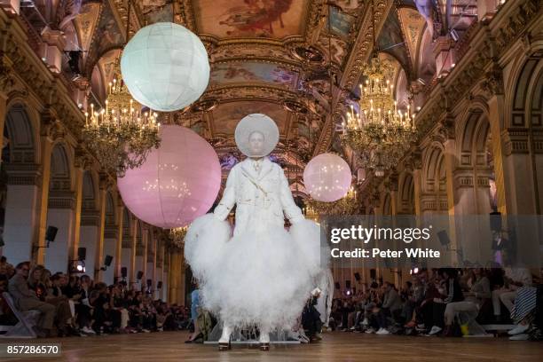 Model walks the runway during the Thom Browne fashion show as part of the Paris Fashion Week Womenswear Spring/Summer 2018 on October 3, 2017 in...