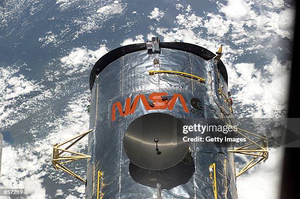 The Hubble Space Telescope orbits some 350 miles above the Pacific Ocean southwest of Mexico, March 3, 2002 as the Space Shuttle Columbia prepares to...