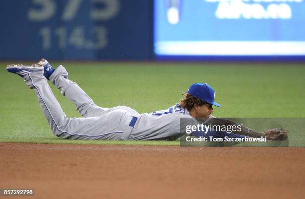 Raul Mondesi of the Kansas City Royals dives but cannot get to a single hit into center field in the seventh inning during MLB game action against...