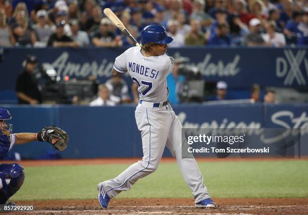 Raul Mondesi of the Kansas City Royals hits an RBI single in the eighth inning during MLB game action against the Toronto Blue Jays at Rogers Centre...