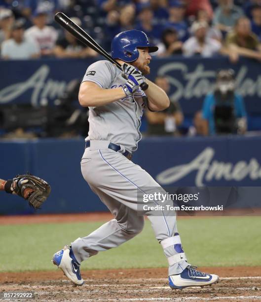 Brandon Moss of the Kansas City Royals hits a single in the ninth inning during MLB game action against the Toronto Blue Jays at Rogers Centre on...