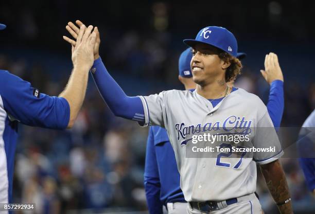 Raul Mondesi of the Kansas City Royals celebrates their victory with teammates during MLB game action against the Toronto Blue Jays at Rogers Centre...