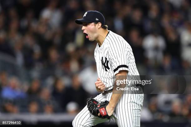 Tommy Kahnle of the New York Yankees celebrates the final out of the top of the seventh inning against the Minnesota Twins in the American League...