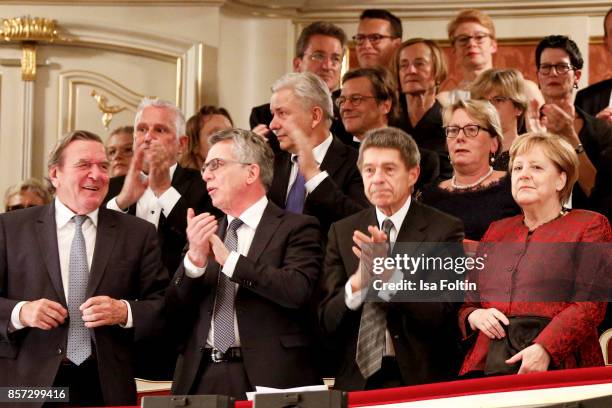Former German chancellor Gerhard Schroeder, German politician Thomas de Maiziere, Joachim Sauer and his wife German chancellor Angela Merkel during...