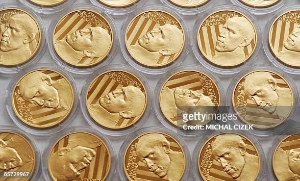 The Jablonex mint factory shows off a commemorative gold medal featuring US President Barack Obama, on March 31, 2009 in the Czech Republic city of...