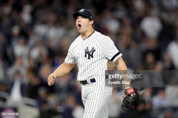 Tommy Kahnle of the New York Yankees reacts after the final out of top of the eighth inning against the Minnesota Twins in the American League Wild...