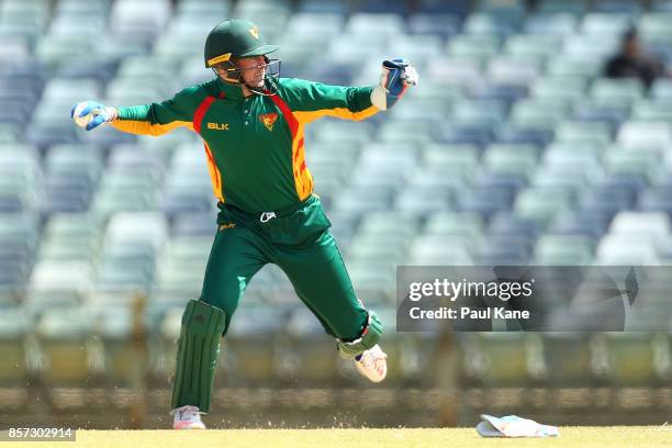 Ben Dunk of the Tigers looks for a run out during the JLT One Day Cup match between Victoria and Tasmania at WACA on October 4, 2017 in Perth,...