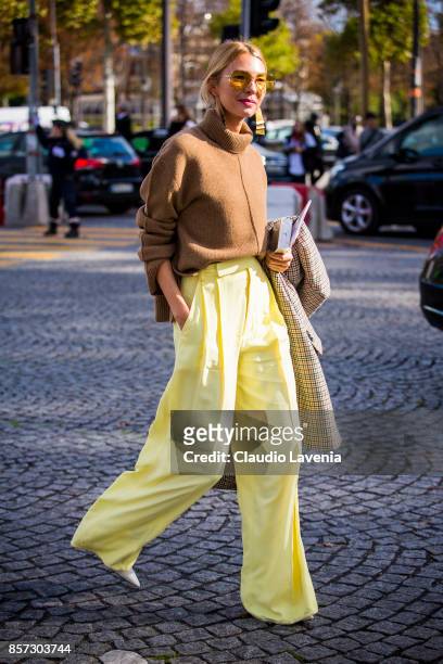 Roberta Benteler wearing brown turtleneck and wide leg pants is seen in the streets of Paris, after the Chanel show during Paris Fashion Week...