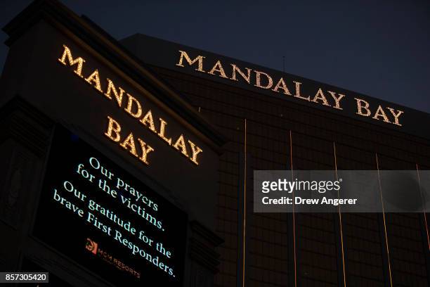Message of condolences for the victims of Sunday night's mass shooting is displayed outside the Mandalay Bay Resort and Casino, October 3, 2017 in...