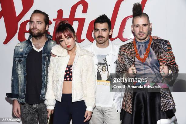 Musicians Jack Lawless, JinJoo Lee, Joe Jonas and Cole Whittle of the band DNCE arrive at the grand opening of Westfield Century City at Westfield...