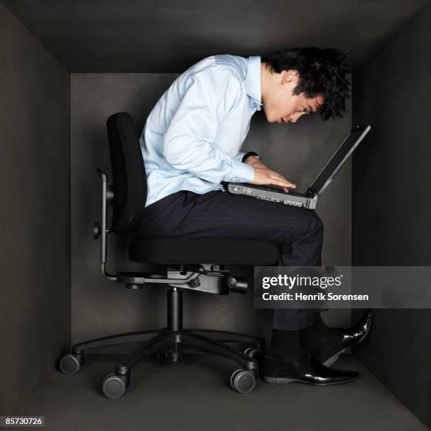 business man trapped inside a small black room - box trap stock pictures, royalty-free photos & images