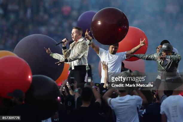 Macklemore performs prior to the 2017 NRL Grand Final match between the Melbourne Storm and the North Queensland Cowboys at ANZ Stadium on October 1,...