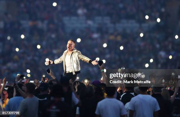 Macklemore performs prior to the 2017 NRL Grand Final match between the Melbourne Storm and the North Queensland Cowboys at ANZ Stadium on October 1,...