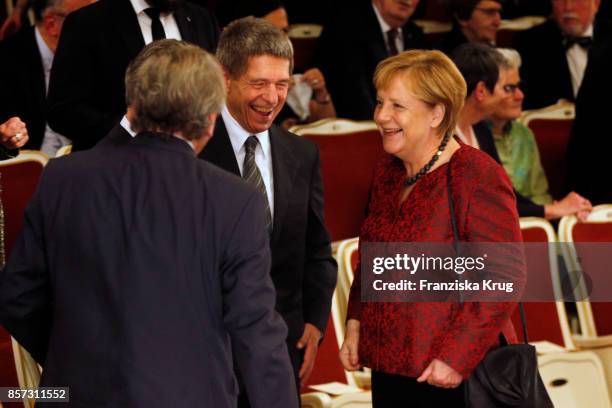 German Chancellor Angela Merkel and her husband Joachim Sauer attend the Re-Opening of the Staatsoper Unter den Linden on October 3, 2017 in Berlin,...