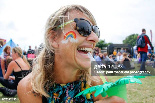smiling ladt at outdoor festival - only mature women stockfoto's en -beelden