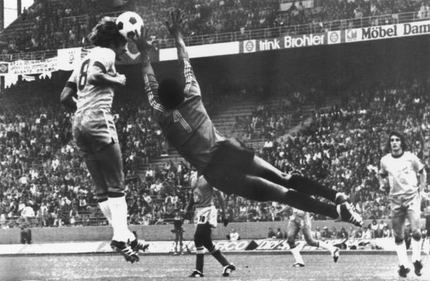 Zaire goalkeeper Kazadi reaches for tha ball as Brazil's Jao Leivnha heads a shot during their group stage match at the 1974 World Cup in...