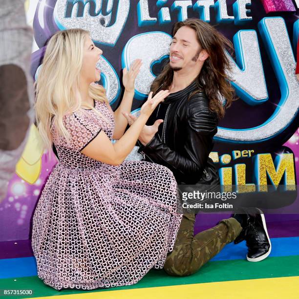 Swiss singer Beatrice Egli and German singer Gil Ofarim attend the 'My little Pony' Premiere at Zoo Palast on October 3, 2017 in Berlin, Germany.