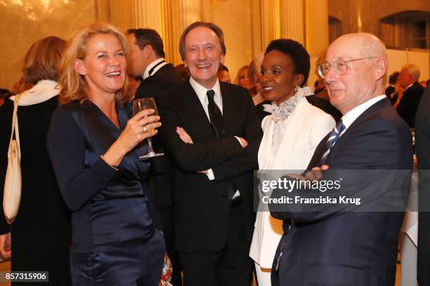 Karin Hinrichs-Aust, Marius Mueller-Westernhagen, Lindiwe Suttle and Stefan Aust attend the Re-Opening of the Staatsoper Unter den Linden on October...