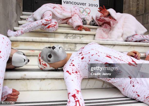 Protesters stage a Die-In against seal hunting with one protester draped in a white fur coat donated by Sex and the City star Kim Cattrall, at Canada...