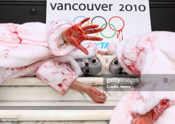 Protesters stage a Die-In against seal hunting with one protester draped in a white fur coat donated by Sex and the City star Kim Cattrall, at Canada...