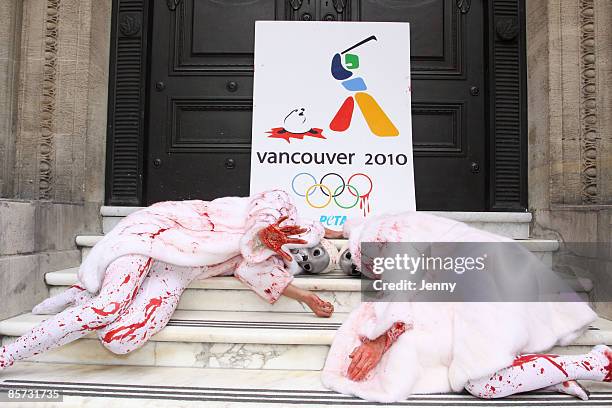 Protesters stage a Die-In against seal hunting with one protester draped in a white fur coat donated by Sex and the City star Kim Cattrall, at Canada...