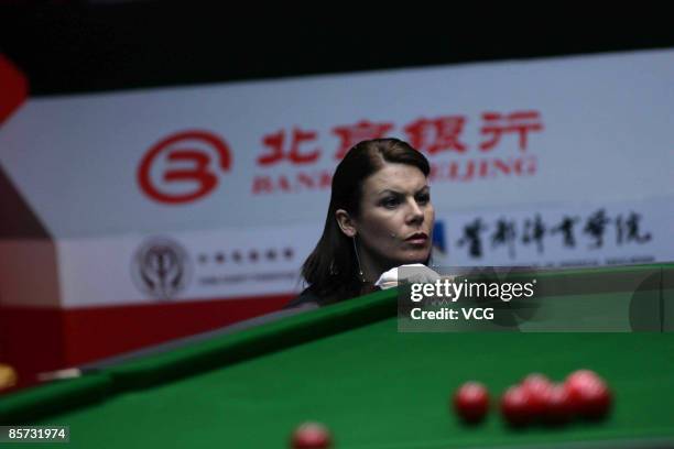 Snooker Match Referee Michaela Tabb checks on the position of the ball during the match between John Higgins of Scotland and Anthony Hamilton of...