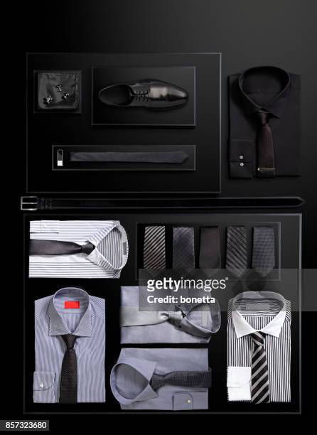 men’s clothing and personal accessories - black shirt folded stock pictures, royalty-free photos & images