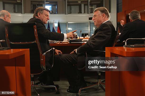 Outgoing Deutsche Bahn CEO Hartmut Mehdorn and Klaus Mangold, Daimler Board member and head of the German Economic East Commission, attend a meeting...