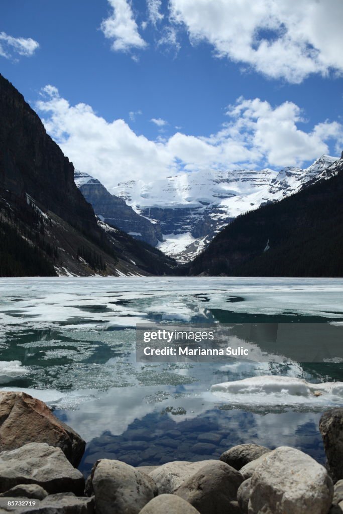 View of Lake Louise with ice still on the lake