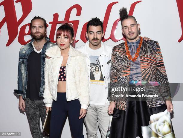 Musicians Jack Lawless, JinJoo Lee, Joe Jonas, and Cole Whittle of the band DNCE arrive at the grand opening of Westfield Century City at Westfield...