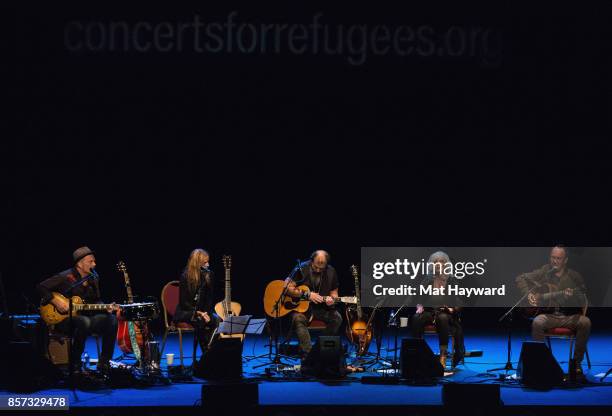 David Pulkingham, Patty Griffin, Steve Earle, Emmylou Harris and Dave Matthews perform on stage during Lampedusa Concerts for Refugees tour at The...