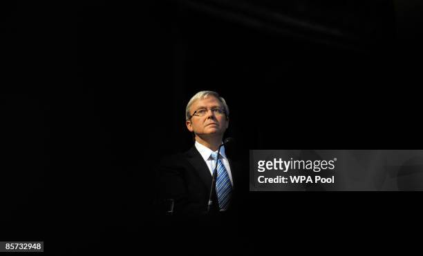 Australian Prime Minister Kevin Rudd listens to Prime Minister Gordon Brown as he address faith leaders, at St Paul's Cathedral in London March 31,...