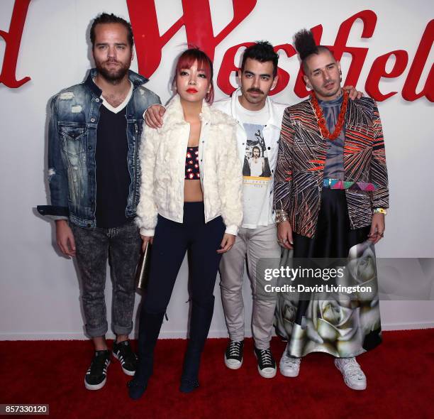 Musicians Jack Lawless, JinJoo Lee, Joe Jonas and Cole Whittle of DNCE attend the grand opening of Westfield Century City at Westfield Century City...