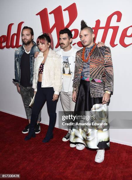 Musicians Jack Lawless, JinJoo Lee, Joe Jonas, and Cole Whittle of the band DNCE arrive at the grand opening of Westfield Century City at Westfield...