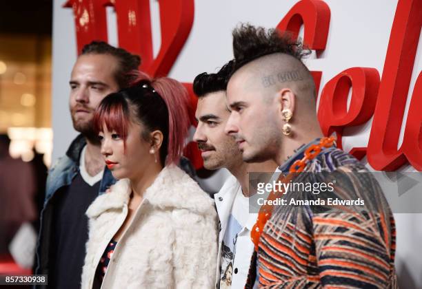Musicians Jack Lawless, JinJoo Lee, Joe Jonas, and Cole Whittle of the band DNCE arrive at the grand opening of Westfield Century City at Westfield...