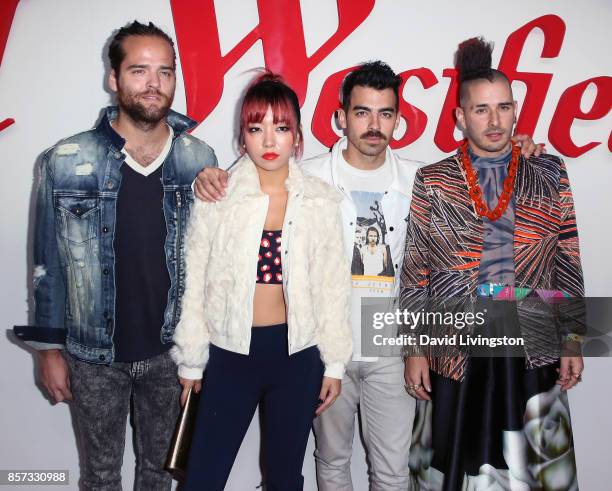 Musicians Jack Lawless, JinJoo Lee, Joe Jonas and Cole Whittle of DNCE attend the grand opening of Westfield Century City at Westfield Century City...