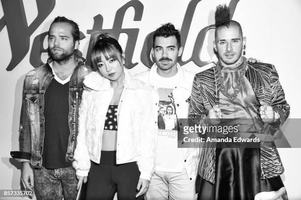 Musicians Jack Lawless, JinJoo Lee, Joe Jonas, and Cole Whittle of the band DNCE arrive at the grand opening of Westfield Century City at Westfield...