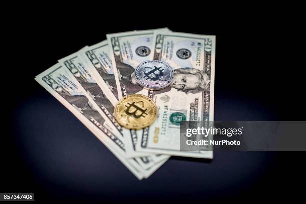 View of Bitcoin physical token and U.S. Dollar