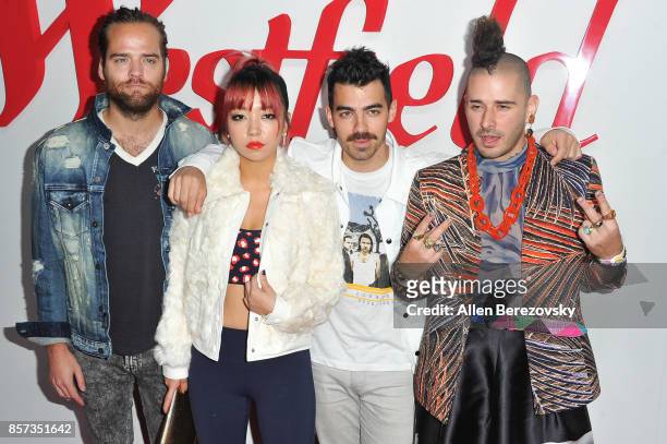 Musicians Jack Lawless, JinJoo Lee, Joe Jonas and Cole Whittle of DNCE attend the grand opening of Westfield Century City at Westfield Century City...