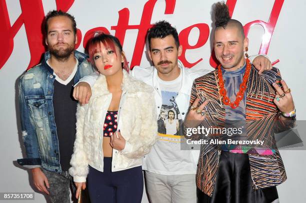 Musicians Jack Lawless, JinJoo Lee, Joe Jonas and Cole Whittle of DNCE attend the grand opening of Westfield Century City at Westfield Century City...