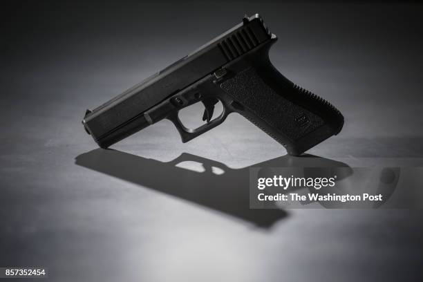 This 9mm pistol, which was purchased in Virginia before being used in several crimes, is pictured at the Office of the Medical Examiner on Wednesday,...