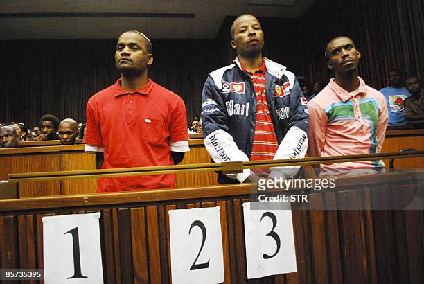 Sifiso Mhlanga , Julio Shirindza and Mbuti Mabe stand before Judge Seun Moshidi -unseen-during the handing down of judgement in the South Gauteng...