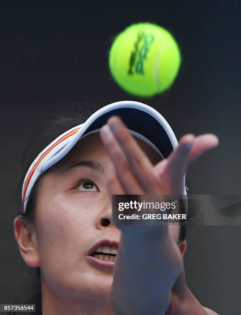 Peng Shuai of China serves during her women's singles match against Monica Nicolescu of Romania at the China Open tennis tournament in Beijing on...