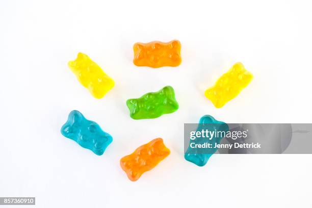 gummy bears on white background - gummi bears stockfoto's en -beelden