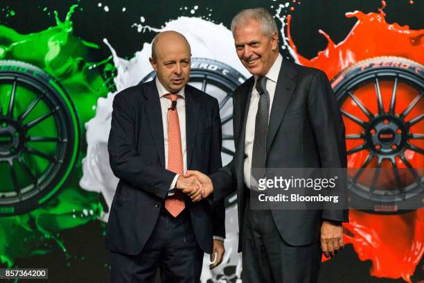 Marco Tronchetti Provera, chief executive officer of Pirelli & C. SpA, right, shakes hands with Raffaele Jerusalmi, chief executive officer of Borsa...