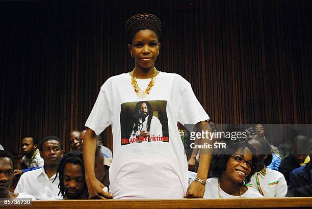 Lucky Dube's wife Zanele, wearing a short portraiting slain music star Lucky Dube, stands before the handing down of judgement of Sifiso Mhlanga,...