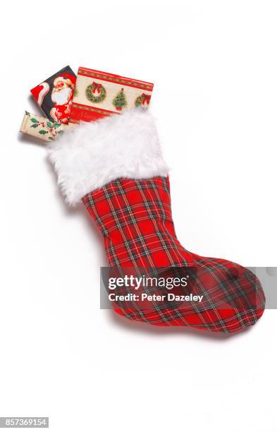 christmas stocking close up with presents - christmas stockings stock-fotos und bilder