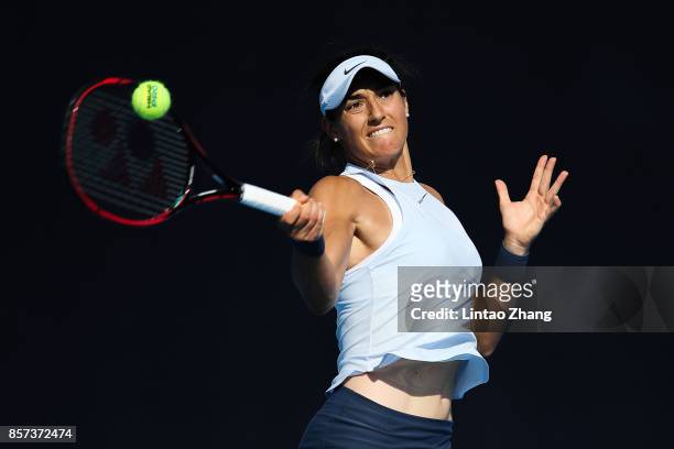 Caroline Garcia of France returns a shot against Elise Mertens of Belgium during the Women's singles second round on day five of 2017 China Open at...