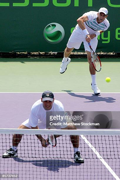 Max Mirnyi of Belarus and Andy Ram of Israel compete against Jeff Coetzee of South Africa and Wesley Moodie of South Africa during day nine of the...