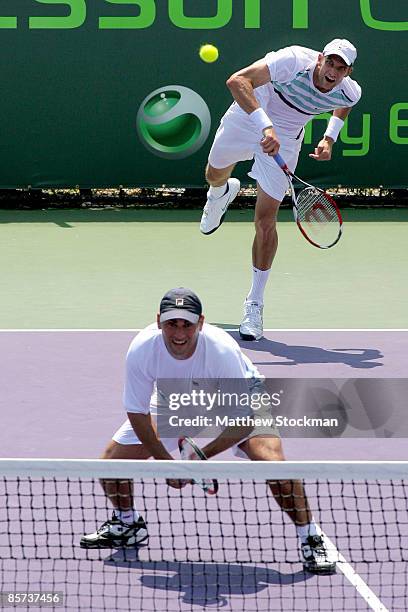 Max Mirnyi of Belarus and Andy Ram of Israel compete against Jeff Coetzee of South Africa and Wesley Moodie of South Africa during day nine of the...